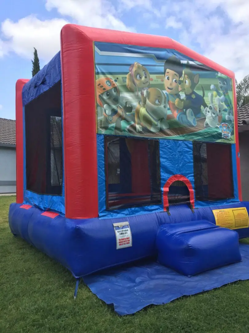 A red and blue inflatable with animals on it.