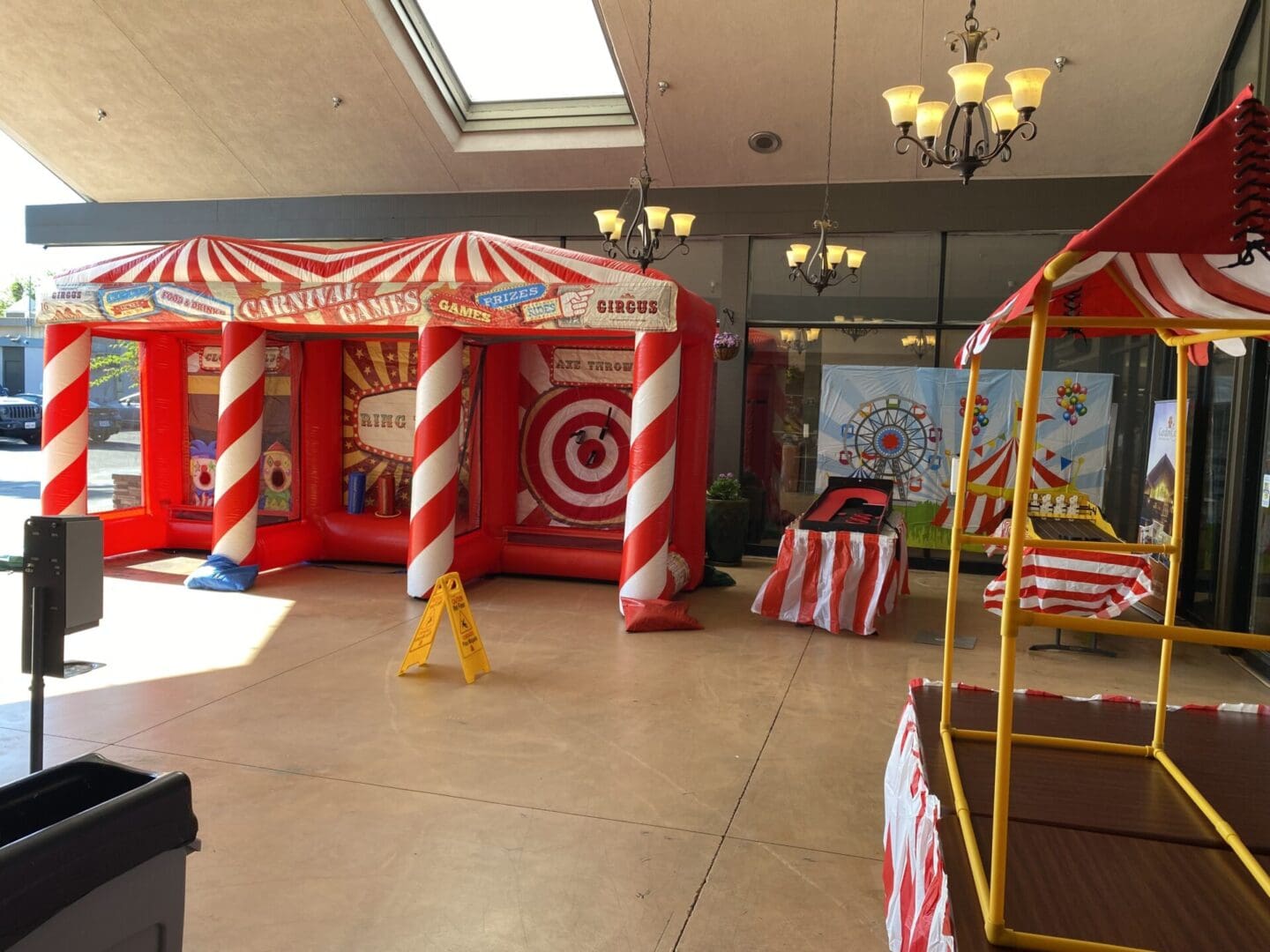 A room with two inflatable tents and a table