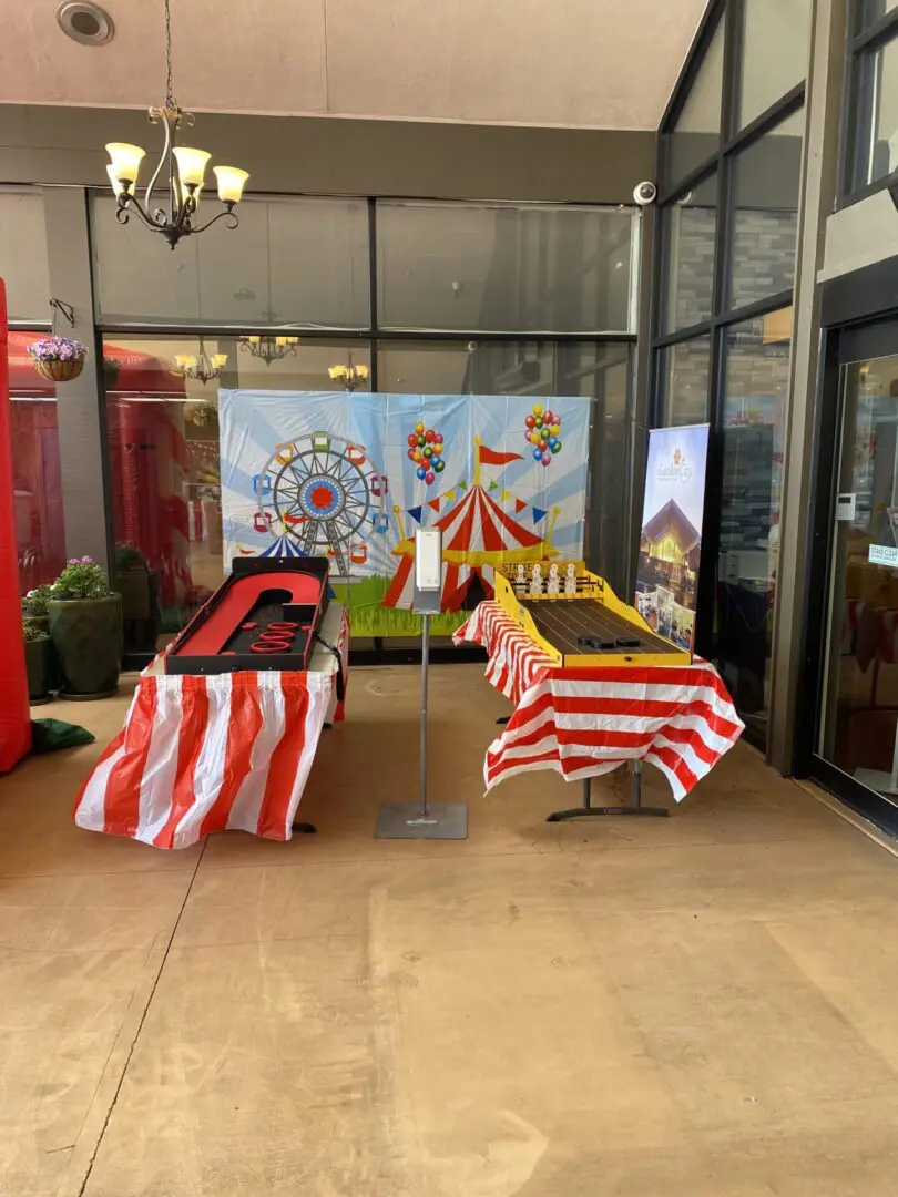 A carnival themed event with tables and chairs