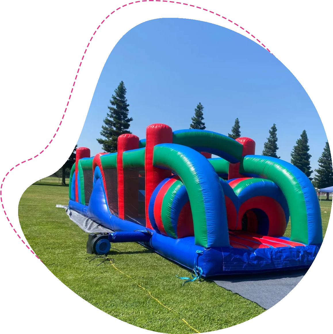 A large inflatable obstacle course in the middle of a field.