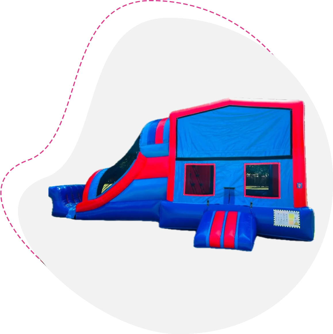 A blue and red inflatable slide with pink streamers.